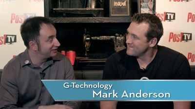 Two men sit facing each other during an interview in front of a Post TV backdrop.