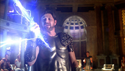 A man in dark armor holds out his hand as bright blue lightning bolts crackle around him.