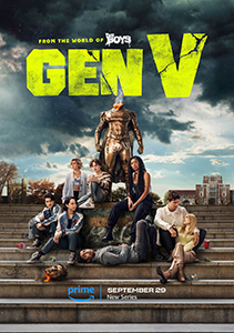A group of young adults poses in front of a large golden statue under a cloudy sky.