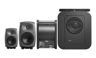 Four black Genelec studio monitors of increasing size from left to right on a white background.