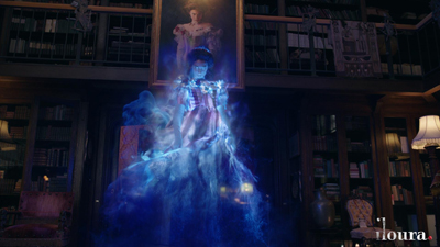 A translucent blue spectral figure rises in a dark library in front of a framed portrait.