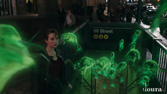 A woman looks on as glowing green ghostly figures swarm around a subway entrance at night.