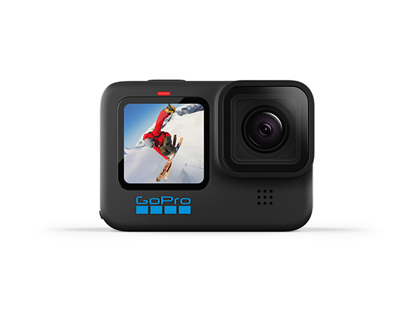 A black GoPro action camera displaying a person skiing on a snowy mountain on its screen.
