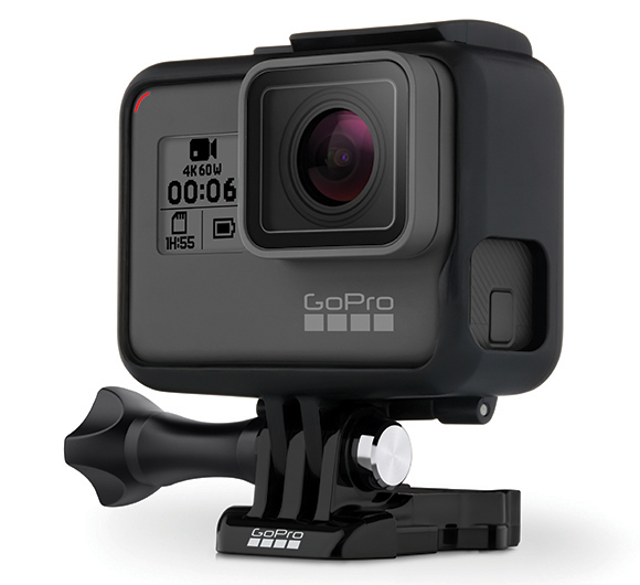 A black GoPro action camera with a digital display and lens, mounted on a black stand.
