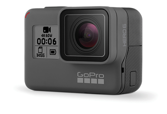 A gray GoPro HERO6 action camera with a large lens and a digital display showing recording status.