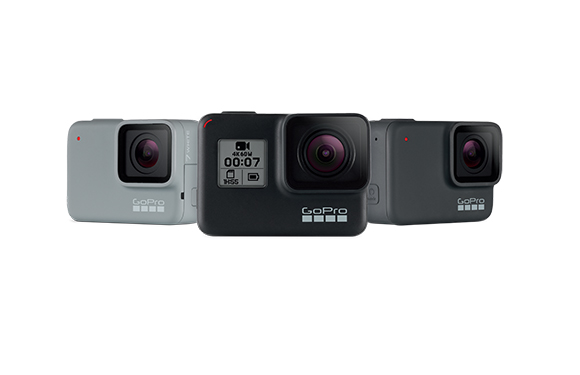 Three GoPro action cameras in white, black, and dark grey arranged against a white background.
