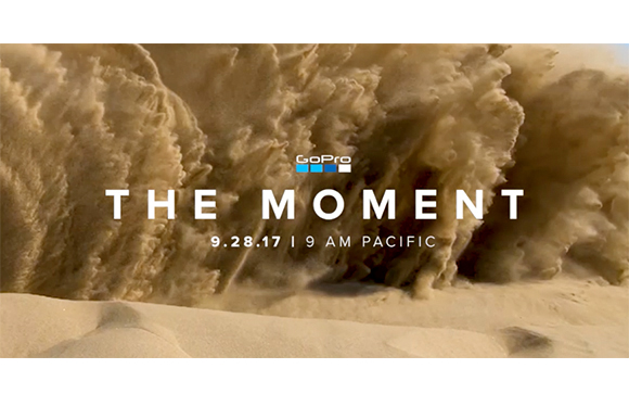 A large sandstorm wall looms over a desert landscape with GoPro text overlay.