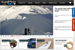 GoPro website showing a first-person view of skiing on a snowy mountain and product advertisements below.