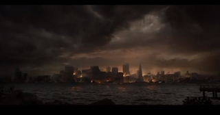 A dark skyline of city buildings under heavy, dramatic storm clouds over a dark sea.