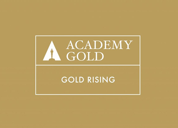 White text and logo reading ACADEMY GOLD and GOLD RISING on a gold background.
