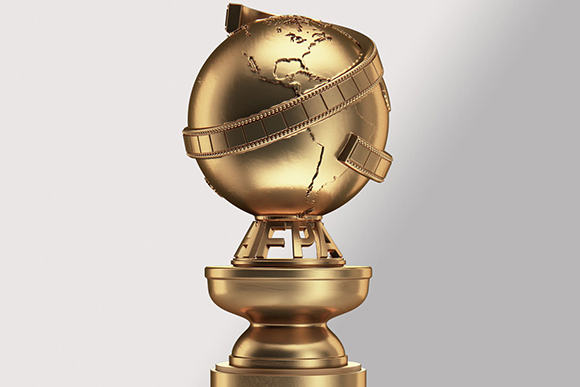 A golden trophy shaped like a globe with a film strip wrapped around it on a plain background.