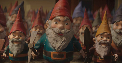 A large group of garden gnomes with various colored hats and white beards looking forward.
