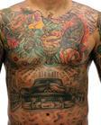A person's chest and abdomen covered in large, colorful, and detailed tattoos.