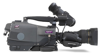 A black professional broadcast video camera with a large lens and viewfinder against a white background.