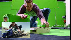 A man leans over toy cars on a wooden block in a green screen studio, with an inset showing a composite shot.