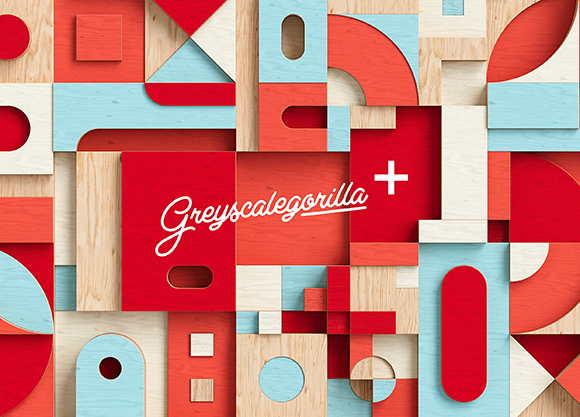 An abstract pattern of red, light blue, and natural wood geometric shapes and blocks.