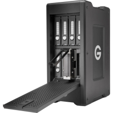 Black external hard drive enclosure with an open loading tray and four vertical drive slots.