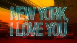 Stylized blue text reading 'NEW YORK, I LOVE YOU' over an orange sunset city street.