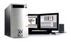 A silver computer tower next to two monitors, a keyboard, and a mouse on a white background.