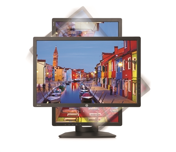 Three computer monitors stacked vertically showing a bright, colorful canal scene with buildings and boats.