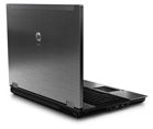 A dark grey laptop viewed from the back, showing the lid and keyboard base.