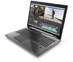 A silver laptop open on a white background, showing a video editing interface with two video clips.
