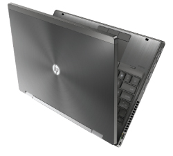 A dark gray laptop viewed from a side angle against a white background.