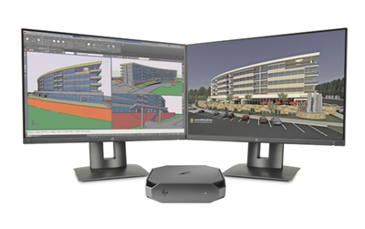 Two computer monitors displaying architectural 3D models next to a small HP desktop computer.