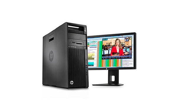 Black HP desktop computer tower next to a widescreen monitor displaying a news broadcast.