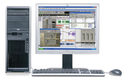 A desktop computer with a tower, monitor displaying audio editing software, keyboard, and mouse.