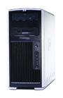 A silver and black vertical desktop computer tower with front-facing disc drives and vertical vents.
