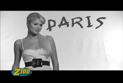 Black and white portrait of a woman in a light dress with the word PARIS in large letters behind her.