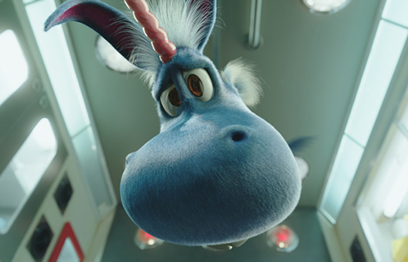 Low angle close-up of a blue animated creature with large eyes and a pink horn looking down.