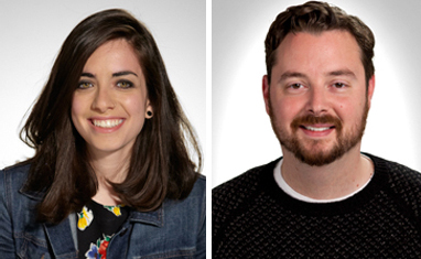 A woman with long dark hair smiling in a denim jacket next to a man with a beard smiling in a black sweater.