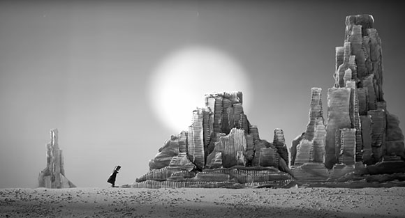 A small silhouette walks across a barren landscape toward jagged rock formations under a massive, bright sun.