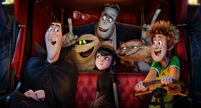 Animated monsters and a young boy smiling inside a red carriage.