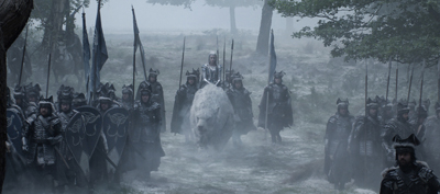 Armored soldiers march through thick fog, led by a figure riding a large white bear.