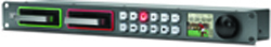 A dark grey rack-mounted device with a green drive bay, a red drive bay, buttons, and a small screen.