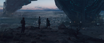Three silhouettes stand on a dark ridge overlooking a sprawling city beneath giant floating spacecraft.