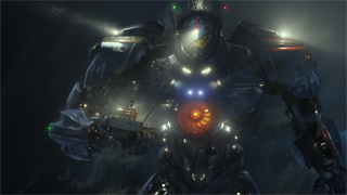 A massive, dark armored robot with glowing blue and orange lights standing in a dark, misty environment.
