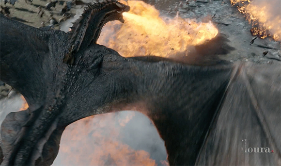 A large, dark-scaled dragon flies over a battlefield filled with fire and smoke.