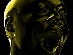 A shiny, golden metallic sculpture of a human face with an open mouth expressing a scream.