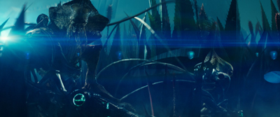 Dark, bioluminescent creatures with organic, insectoid features in a blue-tinted underwater or alien setting.