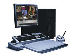 Desktop computer with monitor displaying video, black tower, keyboard, mouse, and a digital drawing tablet.