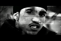 Black and white close-up of a man's face with an American flag and text overlays.