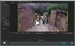 A video player interface displaying a scene of people walking through a narrow canyon between rock walls.