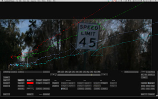 Motion tracking lines in red, green, and blue overlay a speed limit 45 sign in a video editing program.