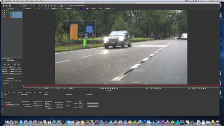 Video editing software interface displaying a car on a road with orange and blue tracking boxes.