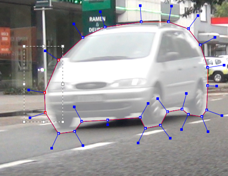 A white minivan on a street with a red outline and blue anchor points overlaid on its shape.