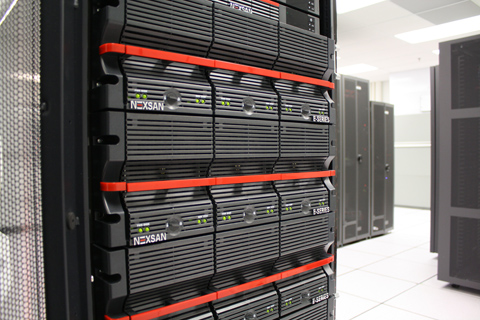 Black Nexsan E-Series server units stacked vertically in a dark metal rack with red accents.